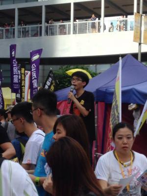 Joshua Wong, convener of Scholarism, at the &quot;The Citizens Against Pseudo-Universal Suffrage&quot; march, Hong Kong, June 14, 2015. HRIC photo.
