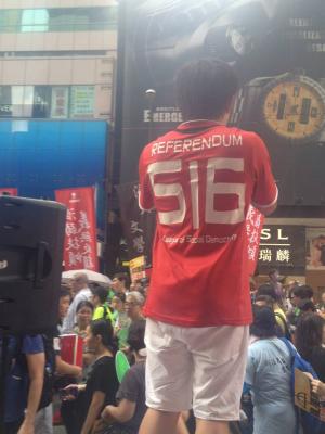 Member of the League of Social Democrats addresses marchers during the democracy march organized by Civil Human Rights Front, Hong Kong, July 1, 2015. HRIC photo.