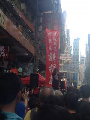 Leung Kwok-hung, also known as &quot;Long Hair,&quot; of the League of Social Democrats, addresses the crowd during the democracy march organized by Civil Human Rights Front,, Hong Kong, July 1, 2015. HRIC photo.